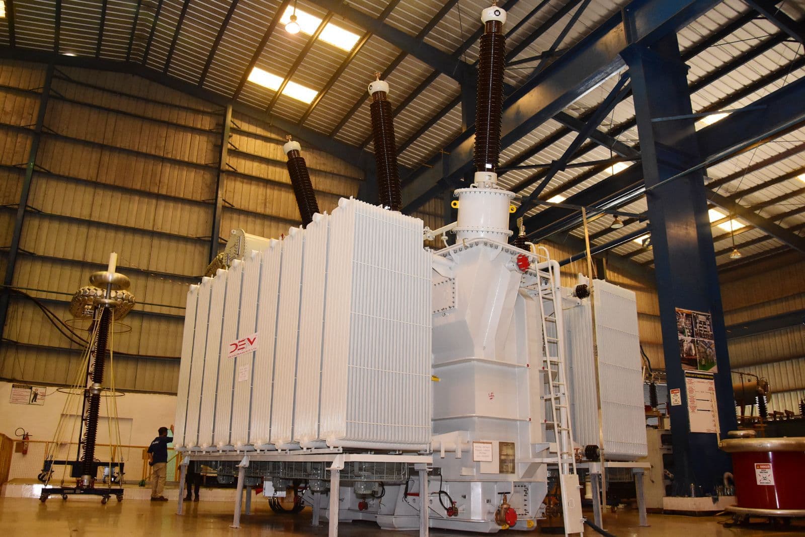 Engineers supervising transformer installation and commissioning on-site
