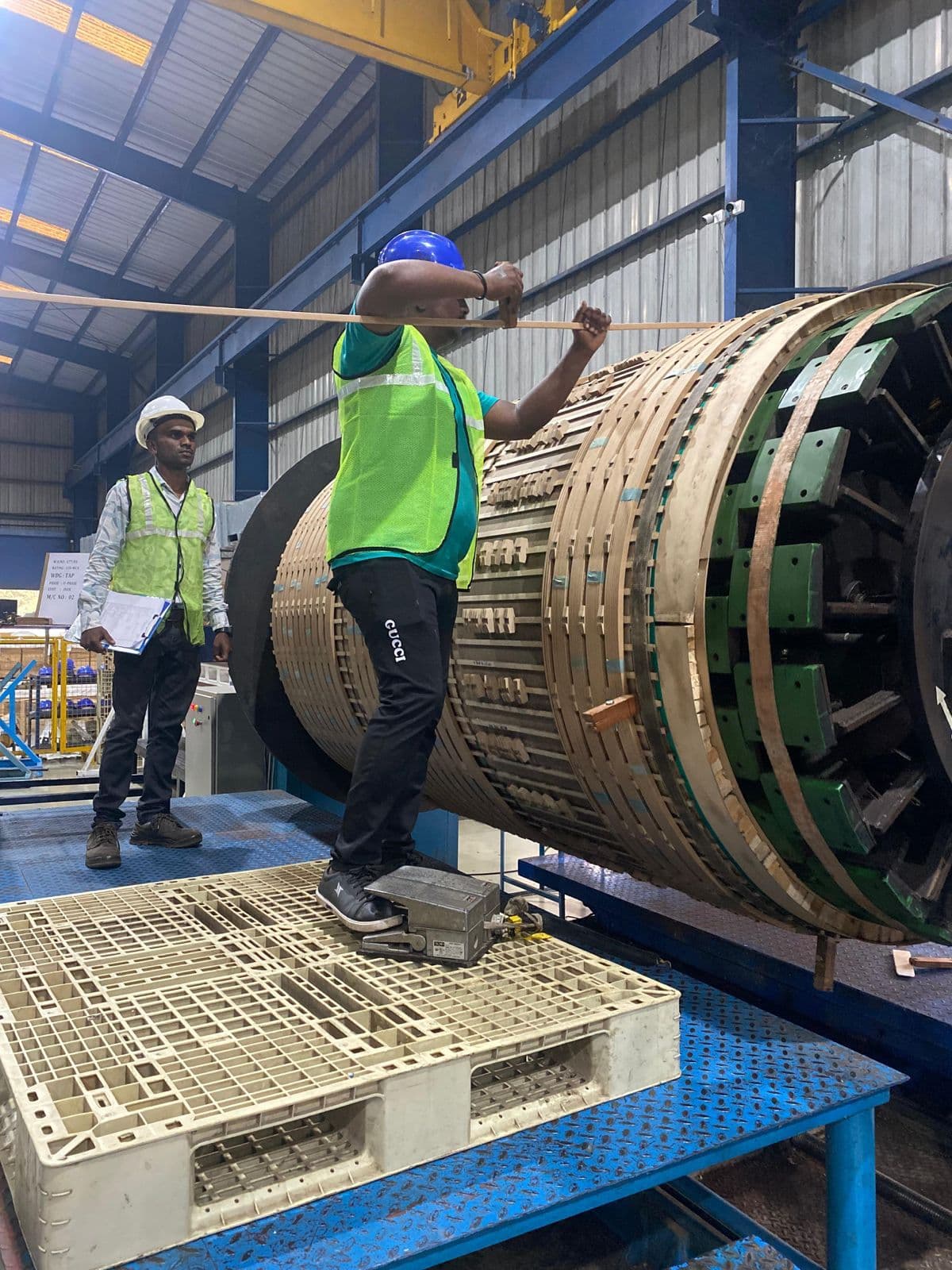 Field engineers performing preventive maintenance on power transformer